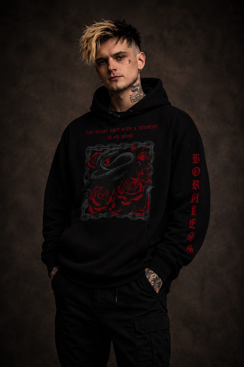 Person wearing a black hoodie with red graphics and text on a dark background