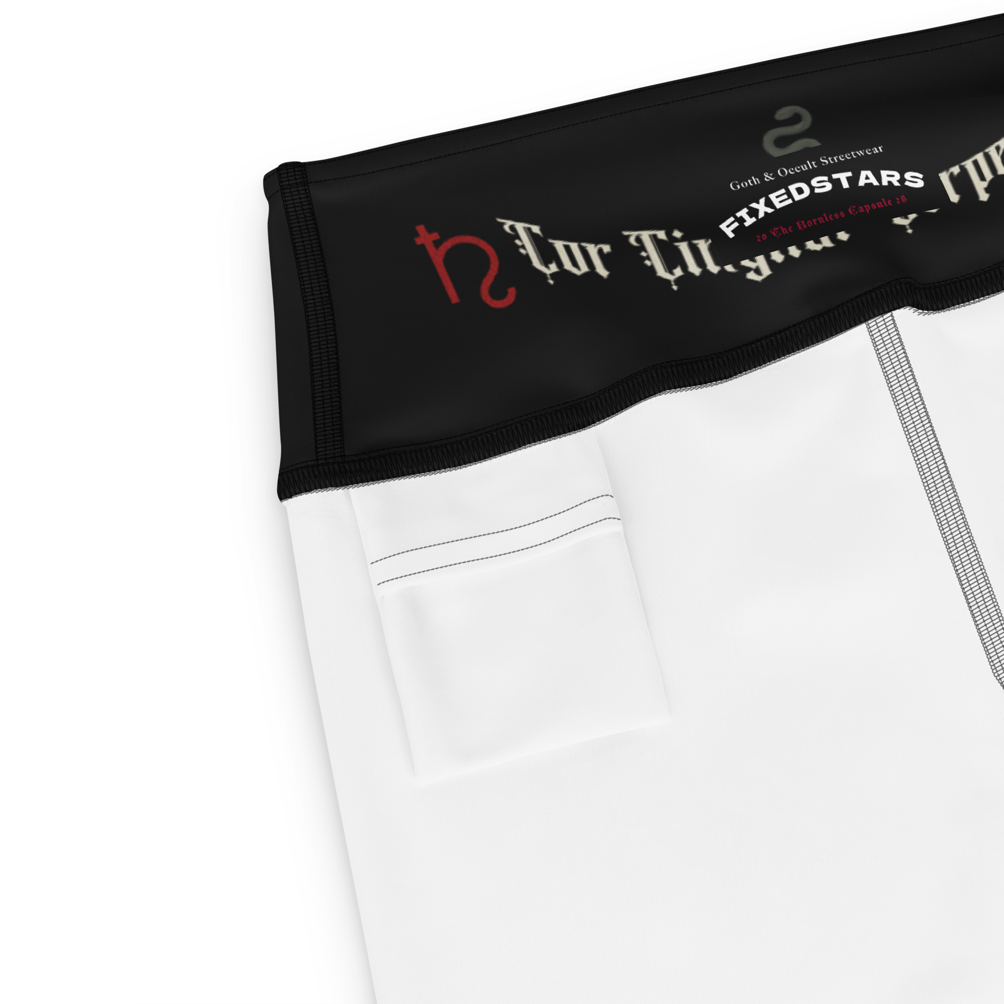 Close-up of a white garment with black waistband featuring branding text and logos.