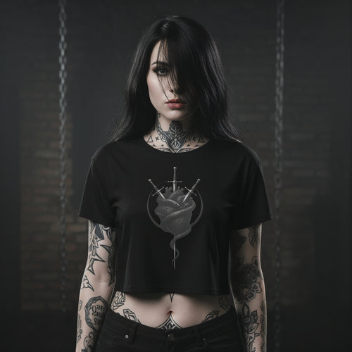 Woman wearing a black t-shirt with a graphic design against a dark background